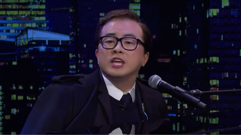 Watch: Bowen Yang - as George Santos - Bids Goodbye to SNL with 'Scandals in the Wind'