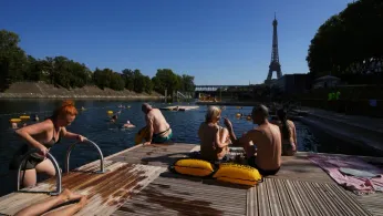 The Seine in Paris Is Open for Swimming. Tourists and Residents Embrace It As Temperatures Soar