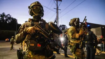 The Latest: Trump Says Officials Opposing Guard Deployment Should Be Jailed